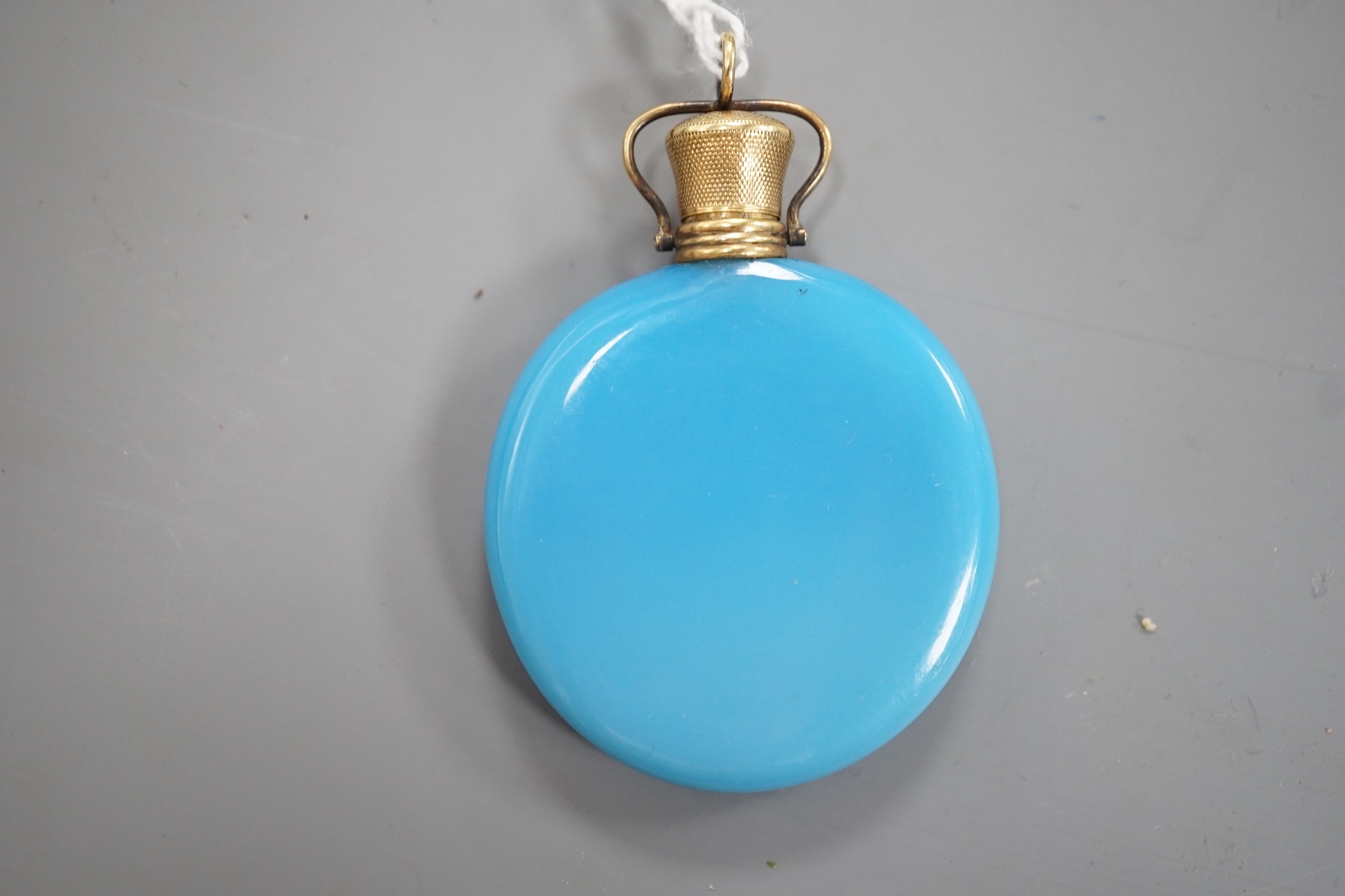 A French? yellow metal mounted blue glass moon shaped scent flask, 56mm.
